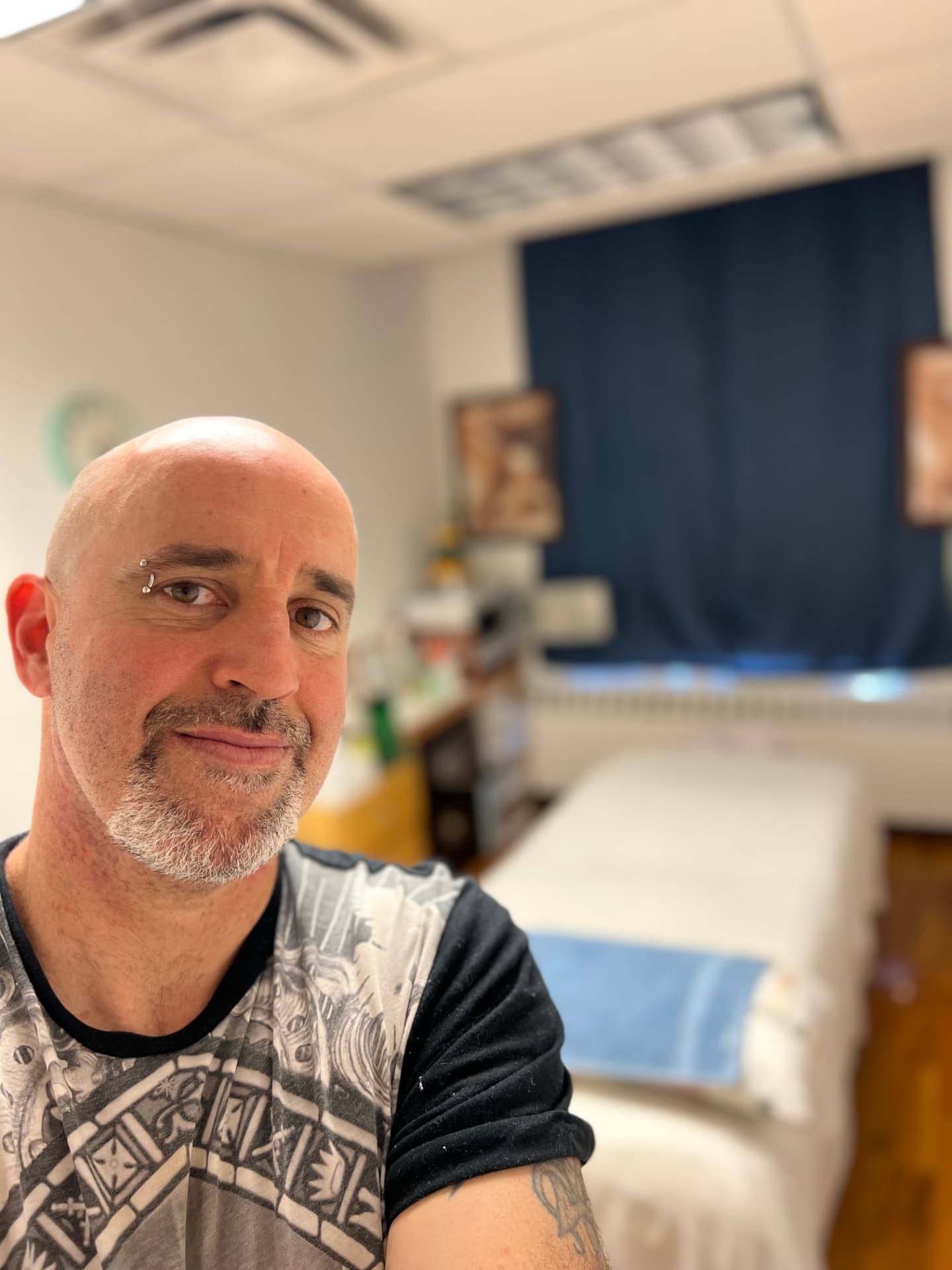 Rich Cotter in his home massage studio in Chicago